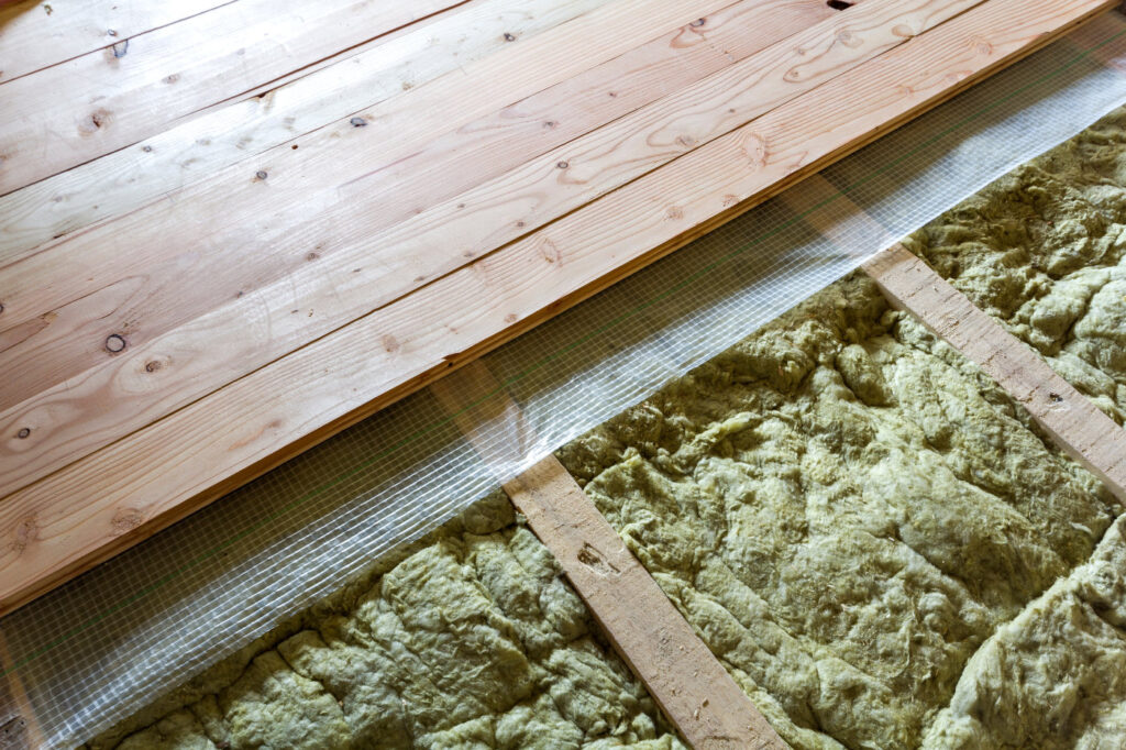 New natural hardwood floor, with insulation installed for keeping floor and house warm.