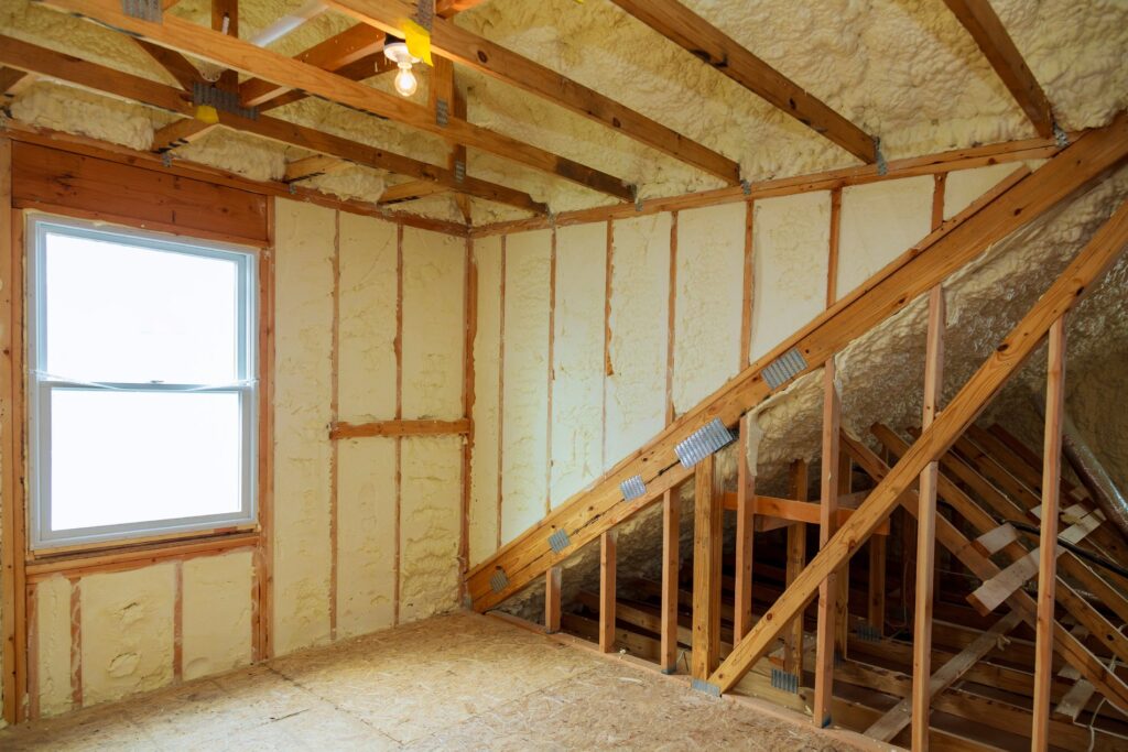 A room at a newly constructed home is sprayed with liquid insulating foam.