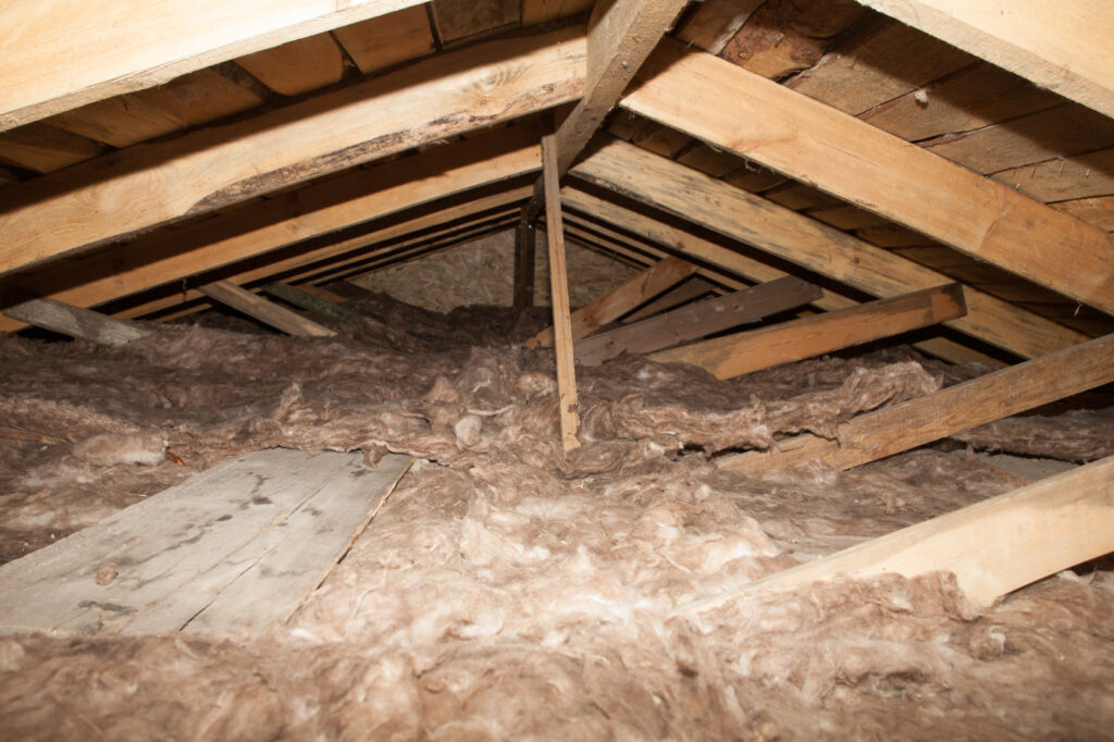 Sagging mineral wool insulation in an attic.