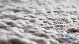 Close-up of the surface of polyurethane spray foam insulation shortly after installation