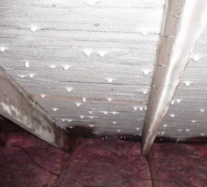 Frost on attic roof sheathing.