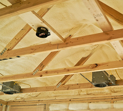 Spray foam insulation between rafters and joists.