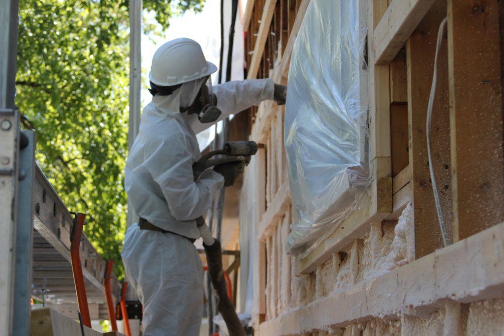 Spray foam renovation being applied to heritage home in Winnipeg Manitoba. 