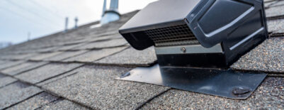 Static vent installed on a residential shingle roof for passive attic ventilation.